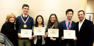 Outstanding Physical Education Award winners Gabriel Lefkowitz, Glory Chung, Jessica Rothstein and Kevin Li are joined by Tara Casey-Rosenthal, physical education teacher at South High, and Eamonn Flood, athletic director and physical education department chair at North High, during the Nassau Zone awards banquet on Dec. 11. (Photo courtesy of Great Neck Public Schools)