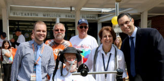 Ride for Life founder Christopher Pendergast is joined by teacher Christopher Lynch, Ride participants Paul Weisman and Nelson Colon, Principal Sharon Fougner, and Michael Grimaldi at the E.M. Baker School. (Photo courtesy of the Great Neck Public Schools)