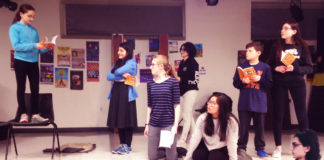 Dana Kagan, Sara Rafaeil, Phoebe Gordon, Sara Chitsaz, Joy Chang, Jack Brenner, Simona Fine and Julian Malater, the cast of “CLUE: The Musical” rehearse for their May and June performances. (Photo courtesy of the Great Neck Library)