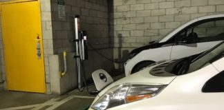 The village's 2017 Nissan Leaf, an electric car, sits parked at a public charging station in a garage. (Photo courtesy of Great Neck Plaza)