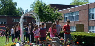 A group of students tour through the newly renovated garden made in honor of Zachary Portnoy, a fourth grader who passed away in 2007. (Photo by Janelle Clausen)