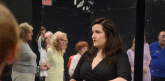 Jadis Armbruster, seen here speaking with an arc of students learning to salsa and swing, will be leading the Gold Coast Arts Center's first ballroom dancing class this summer. (Photo by Janelle Clausen)