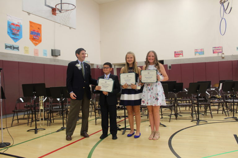 Wink presents award to Manor Oaks students on Moving Up Day