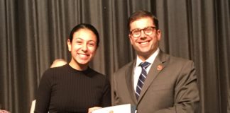 Nassau County Comptroller Jack Schnirman presents the Comptroller’s High School Innovation Award to Rebecca Yaminian at John L. Miller Great Neck North High School. (Photo courtesy of the Comptroller's office)