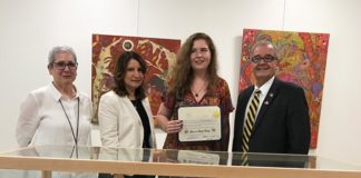 Artist Lauren Skelly Bailey, joined by Great Neck Library Art Committee Chair Pamela Levin, Great Neck Library Director Denise Corcoran and Assemblyman Anthony D'Urso, holds her citation. (Photo courtesy of Assemblyman Anthony D'Urso's office)