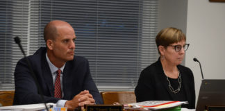 Superintendent of Schools Vincent Butera and Board President Regina Rule listen as students and parents speak. (Photo by Janelle Clausen)