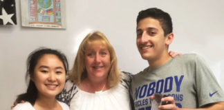 Award winners Annie Park and Spencer Horowitz of South High School are congratulated by American Sign Language teacher Kathy McAleer. (Photo courtesy of the Great Neck Public Schools)