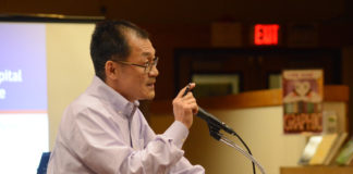 Great Neck resident Bill Lin, who said he has spent most of his adult life in the corporate world, said the board's decision to install a parking lot was based on anecdotes rather than data. (Photo by Janelle Clausen)