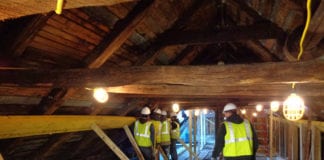 Workers stabilize the Roslyn Grist Mill's timber frame for its restoration. (Photo courtesy of the Roslyn Landmark Society)