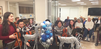 Musicians from North High School visited the Atria to perform for its residents. (Photo courtesy of the Great Neck Public Schools)