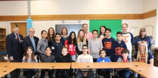Representatives from the North Middle School Student Council are joined by Assemblyman Anthony D’Urso and Vietnam veteran Jack Hirsch; Principal Gerald Cozine and Assistant Principals Nancy Gunning and Jennifer Andersen; and Student Council Advisors Michelle Sicurella, Michael Noberto, Betty Brody, and Rachael Weissman. (Photo courtesy of the Great Neck Public Schools)