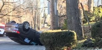A car accident on Beach Road near Great Neck North High School left a vehicle overturned, but no serious injuries. (Photo courtesy of Ruth Gebay)