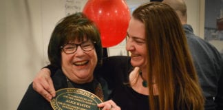 Alice Kasten and her daughter Meredith Zolty joke about how Kasten, who received a plaque normally given only to historical landmarks or buildings, is now a "landmark." (Photo by Janelle Clausen)