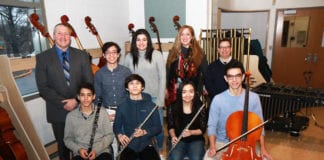 South High School musicians Eli Goldberger, Samuel Levine, Christiana Claus, Nicholas Langel, Benjamin T. Rossen, and Daniella Brancato are photographed with Principal Christopher Gitz, Janine Robinson, vocal music instructor, and Michael Schwartz, performing arts department chair. (Photo courtesy of the Great Neck Public Schools)