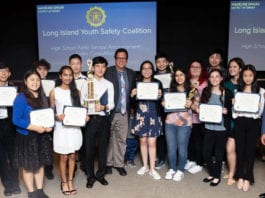 Robert Zahn and award-winning students from GNPS/TV are congratulated by musician Meredith O’Connor and Rene Fiechter, an assistant district attorney and the director of community affairs at an awards ceremony on June 4. (Photo by Anna Zahn)