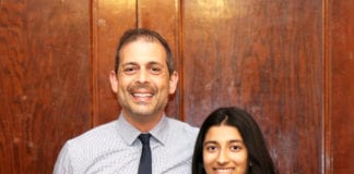 North High School junior Preethi Kumar is congratulated by Principal Daniel Holtzman for being recognized by the Anti-Defamation League. (Photo courtesy of Great Neck Public Schools)