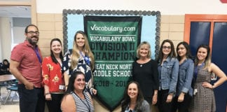 Members of the North Middle English department are photographed with the school’s Vocabulary Bowl championship banner. (Photo courtesy of Great Neck Public Schools)