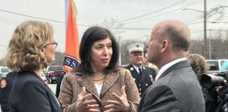 Nassau County District Attorney Madeline Singas of Manhasset, center, speaks with Nassau County Executive Laura Curran and Nassau County Police Commissioner Patrick Ryder after a press conference in 2018 about opioid overdoses. (Photo by Amelia Camurati)