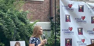 Jacqueline Franchetti speaks to a crowd on lawn of the Parent Resource Center during Kyra's Rally for Change. (Photo by Brandon Duffy)