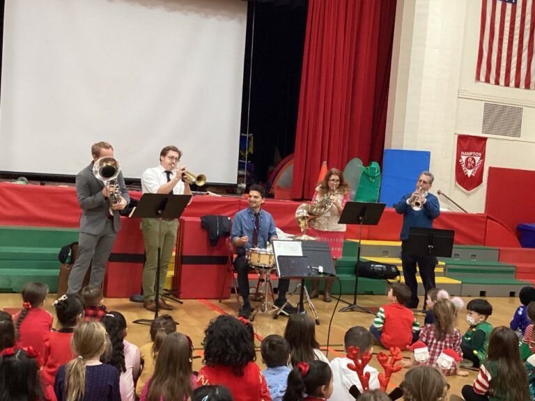 Mineola music teachers perform holiday standards for students