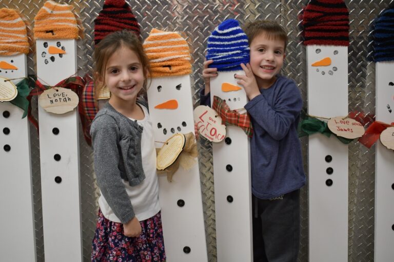 Mineola learners collaborate for holiday snowman project